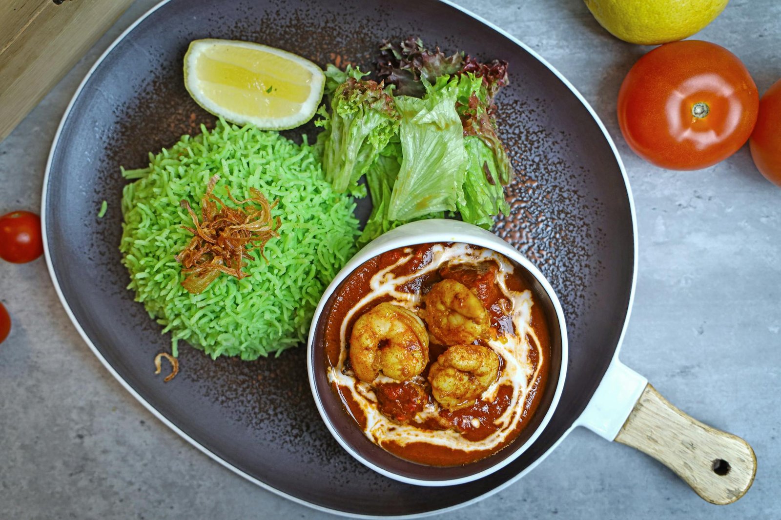 A plate with food on it and a bowl of rice